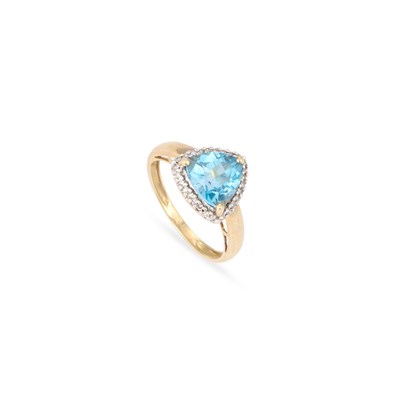 Lot 634 - A 9 CARAT GOLD BLUE TOPAZ AND DIAMOND HALO RING
