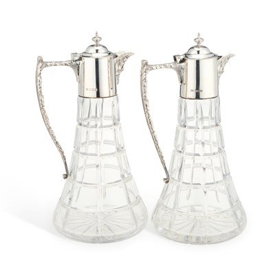 Lot 114 - A PAIR OF ELIZABETH II SILVER-MOUNTED CLARET JUGS