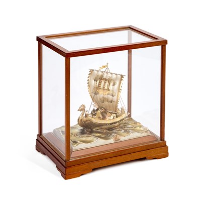 Lot 83 - A JAPANESE PARCEL-GILT SILVER MODEL OF A SINGLE-MASTED TREASURE SHIP