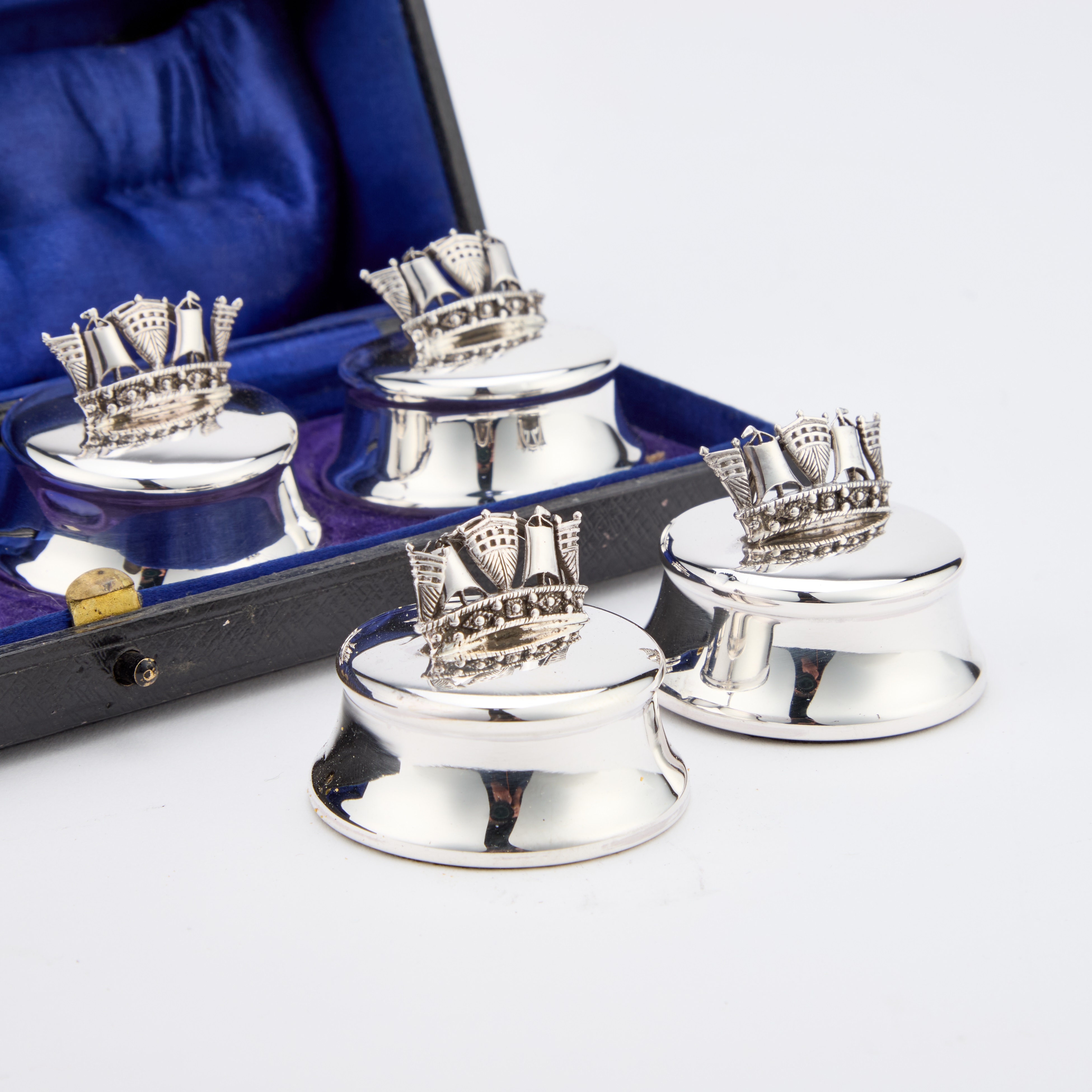Lot 429 - A SET OF FOUR EDWARDIAN SILVER MENU HOLDERS