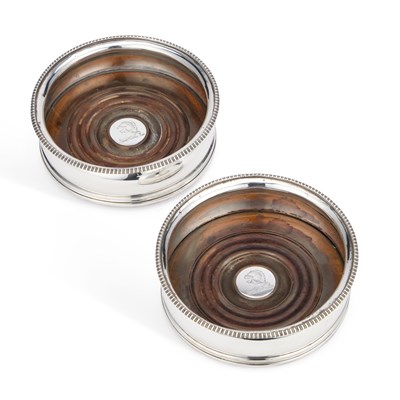 Lot 215 - A PAIR OF GEORGE III SILVER WINE COASTERS