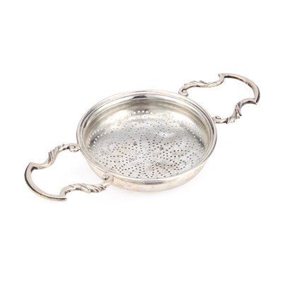 Lot 244 - A GEORGE II SILVER LEMON STRAINER