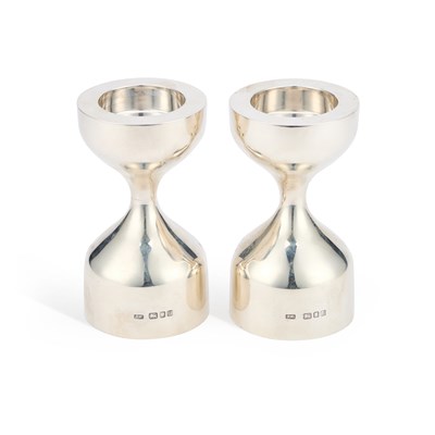 Lot 124 - A PAIR OF CAST MODERNIST SILVER CANDLESTICKS