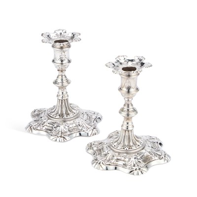 Lot 570 - A PAIR OF LATE GEORGE II CAST SILVER CANDLESTICKS