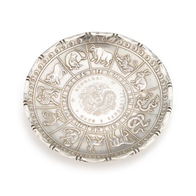 Lot 256 - A CHINESE 'DRAGON DOLLAR' SILVER DISH