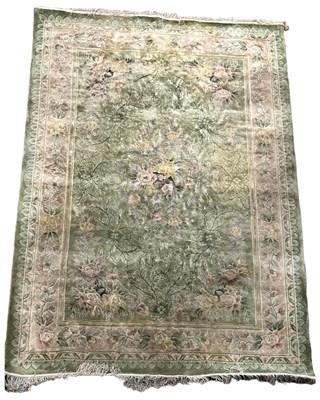 Lot 386 - A CHINESE SILK RUG