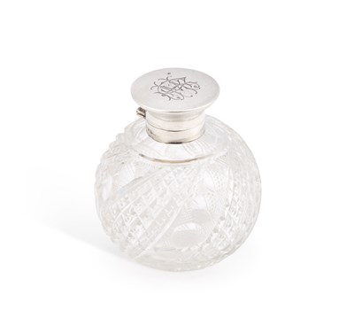 Lot 139 - AN EDWARDIAN SILVER-TOPPED CUT-GLASS SCENT BOTTLE