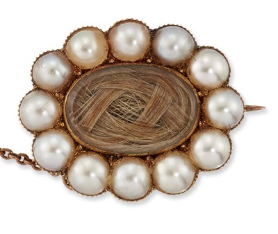 Lot 1559 - A MID 19TH CENTURY SPLIT PEARL AND HAIRWORK MOURNING BROOCH