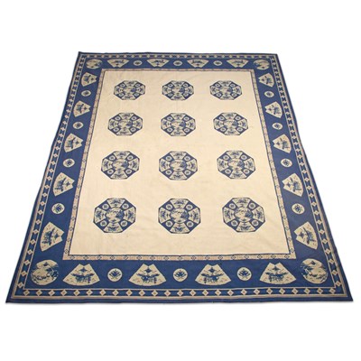 Lot 293 - A BLUE AND WHITE MACHINE-WOVEN WALL-HANGING