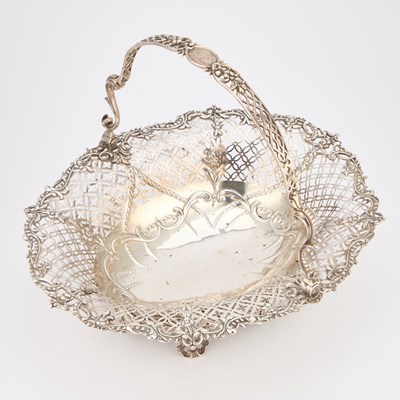 Lot 550 - A GEORGE III SILVER CAKE BASKET