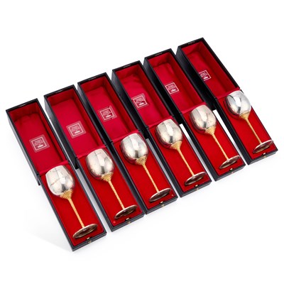 Lot A SET OF SIX LIMITED EDITION ELIZABETH II PARCEL-GILT SILVER GOBLETS