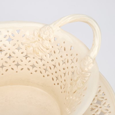 Lot A PAIR OF LEEDS POTTERY CREAMWARE BASKETS ON STANDS