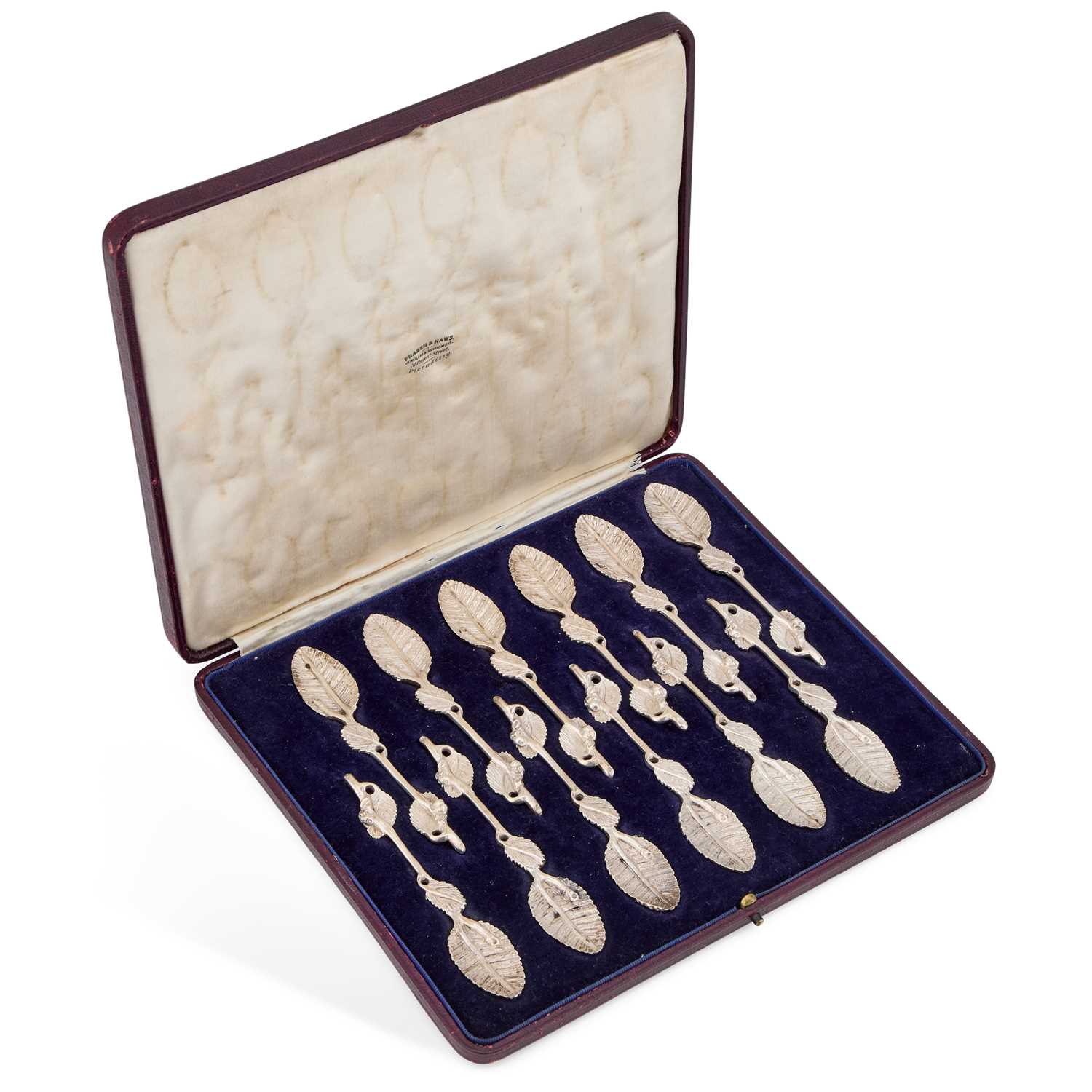 Lot 415 - A SET OF TWELVE GEORGE V SILVER NATURALISTIC TEASPOONS