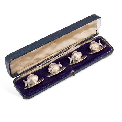 Lot A SET OF FOUR EDWARDIAN SILVER NOVELTY MENU HOLDERS