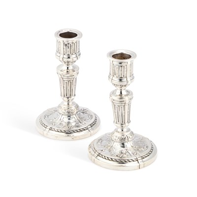 Lot A PAIR OF 19TH CENTURY FRENCH SILVER CANDLESTICKS