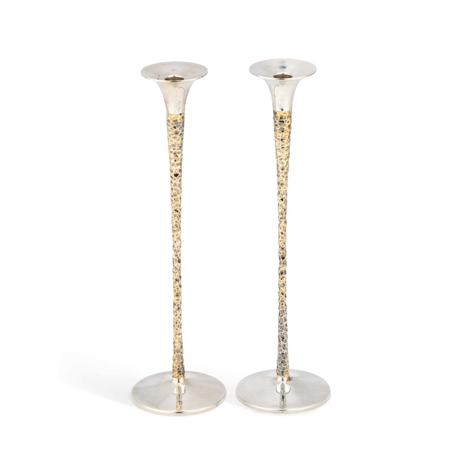 Lot STUART DEVLIN: A PAIR OF ELIZABETH II PARCEL-GILT SILVER CANDLESTICKS