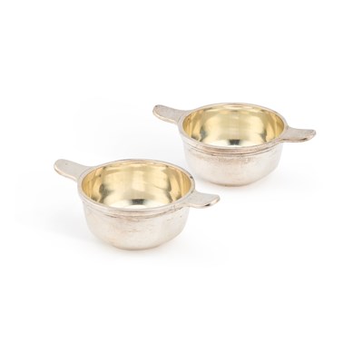 Lot A SMALL PAIR OF EDWARDIAN SCOTTISH SILVER TWO-HANDLED DISHES