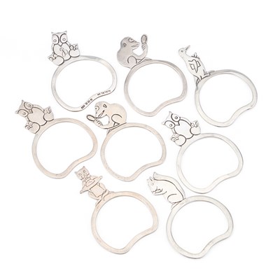 Lot A SET OF EIGHT GEORGE V SILVER NOVELTY NAPKIN RINGS