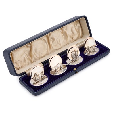 Lot A SET OF FOUR GEORGE V SILVER NOVELTY MENU HOLDERS