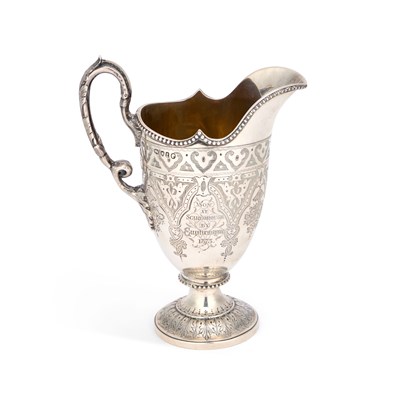 Lot A LARGE VICTORIAN SILVER CREAM JUG