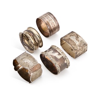 Lot A GROUP OF FIVE SILVER NAPKIN RINGS