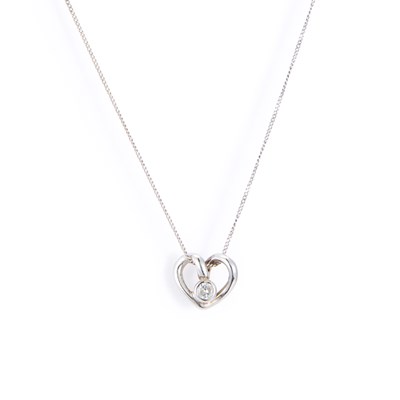 Lot 629 - A 9 CARAT WHITE GOLD DIAMOND PENDANT ON CHAIN