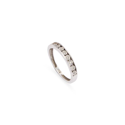 Lot 687 - A 9 CARAT WHITE GOLD DIAMOND HALF ETERNITY RING