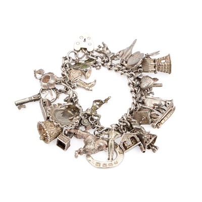Lot 672 - A SILVER CHARM BRACELET
