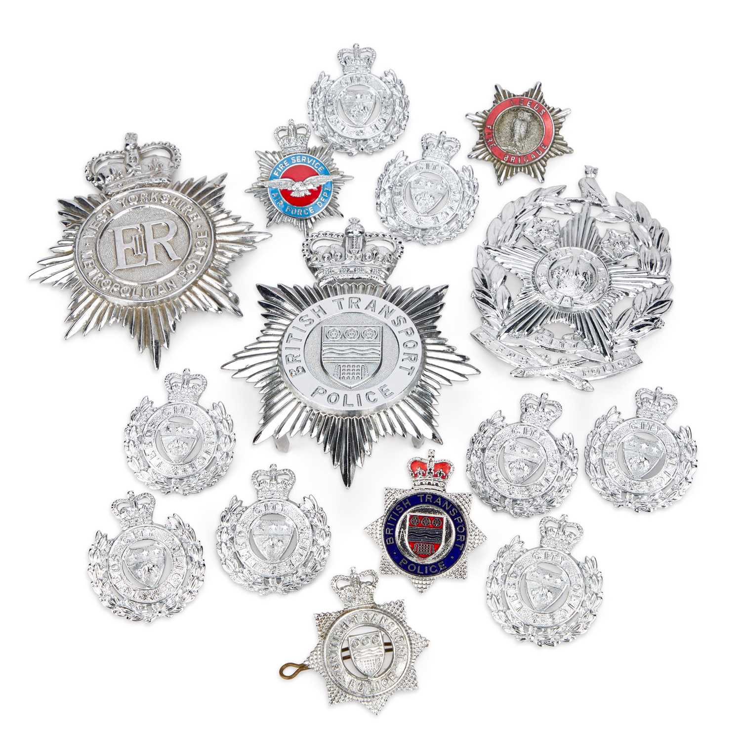 Lot A COLLECTION OF FIRE SERVICE AND POLICE HELMET PLATES AND BADGES