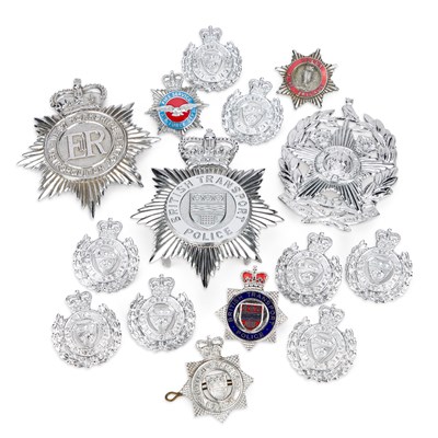 Lot A COLLECTION OF FIRE SERVICE AND POLICE HELMET PLATES AND BADGES