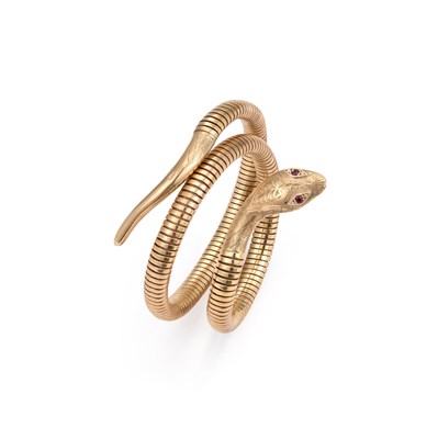 Lot 650 - A 9 CARAT GOLD COILED SNAKE BANGLE