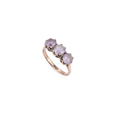 Lot 666 - AN THREE STONE AMETHYST RING