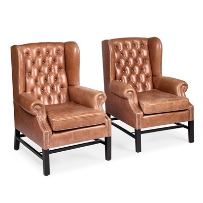 Lot 309 - A PAIR OF BROWN LEATHER UPHOLSTERED WING-BACK ARMCHAIRS