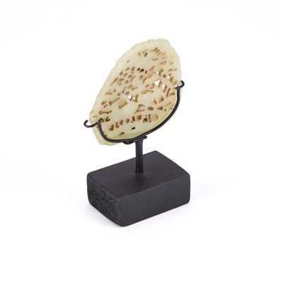Lot 705 - A CHINESE PIERCED AND CARVED JADE PLAQUE