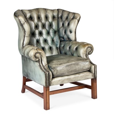 Lot 313 - A GEORGIAN STYLE DEEP-BUTTONED LEATHER WING-BACK ARMCHAIR