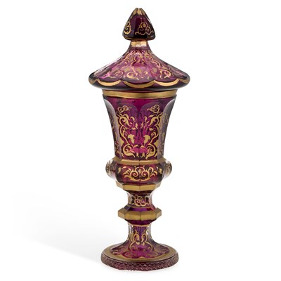Lot 94 - A BOHEMIAN GILT DECORATED AMETHYST GLASS COVERED VASE