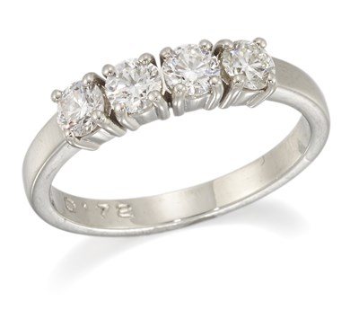 Lot 1695 - A PLATINUM DIAMOND FOUR STONE RING