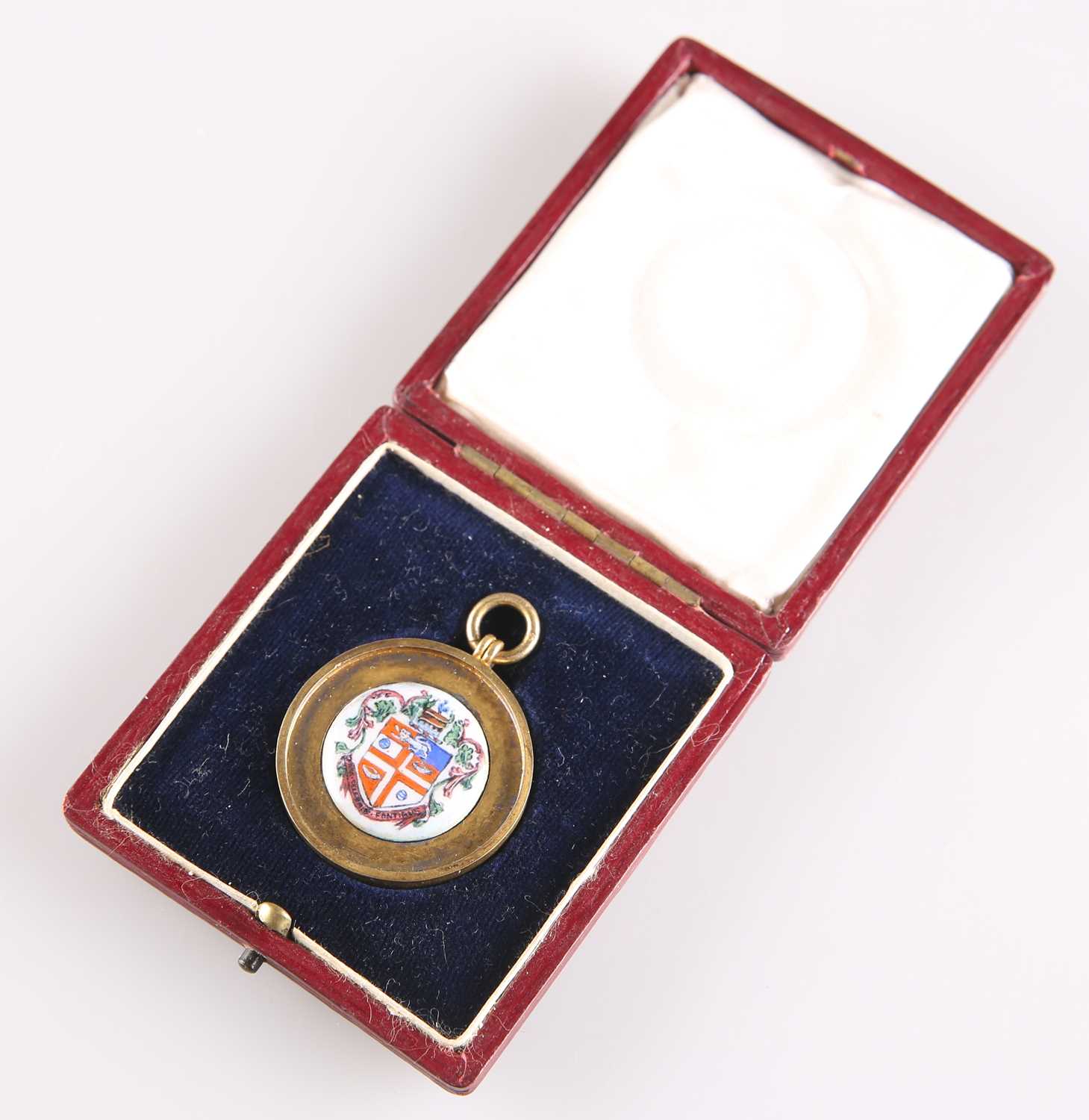 Lot A GEORGE V SILVER-GILT AND ENAMEL 'HARROGATE' FOB MEDALLION