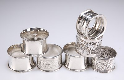 Lot 1434 - SEVEN SILVER NAPKIN RINGS, VICTORIAN AND LATER