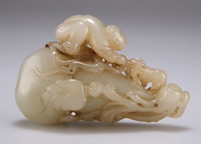 Lot 267 - A CARVED JADE GROUP