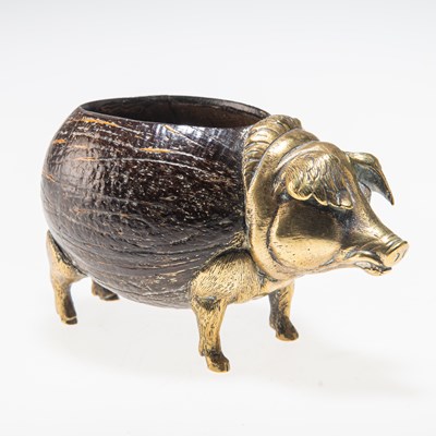 Lot 216 - A 19TH CENTURY BRASS-MOUNTED COCONUT PIG