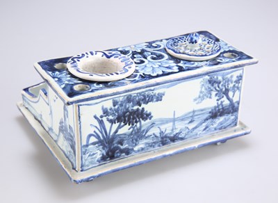 Lot 89 - AN 18TH CENTURY DUTCH DELFT INKWELL DESK STAND