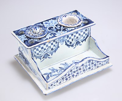 Lot 89 - AN 18TH CENTURY DUTCH DELFT INKWELL DESK STAND