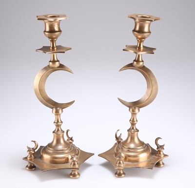 Lot 389 - A PAIR OF 19TH CENTURY ISLAMIC OTTOMAN BRASS CANDLESTICKS