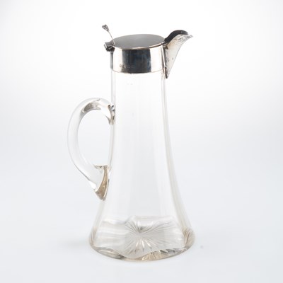 Lot 1169 - AN EDWARDIAN SILVER-MOUNTED CLARET JUG