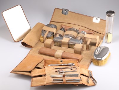 Lot 1258 - AN EDWARDIAN GENTLEMAN'S SILVER-TOPPED DRESSING TABLE SET AND MANICURE SET