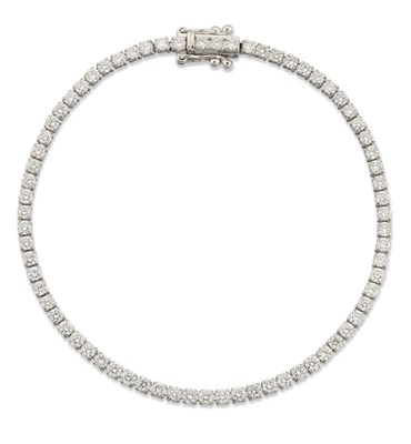 Lot 1599 - AN 18 CARAT WHITE GOLD DIAMOND LINE BRACELET