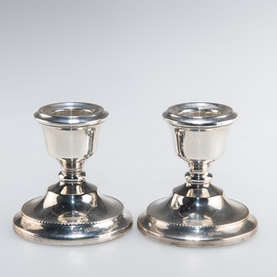 Lot 1147 - A PAIR OF ELIZABETH II SILVER DWARF CANDLESTICKS