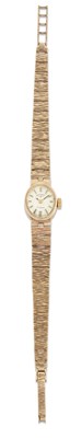 Lot 1378 - A 9 CARAT GOLD ROTARY BRACELET WATCH