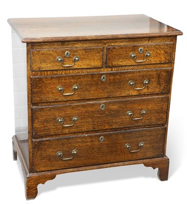 Lot 372 - A GEORGE III OAK CHEST OF DRAWERS